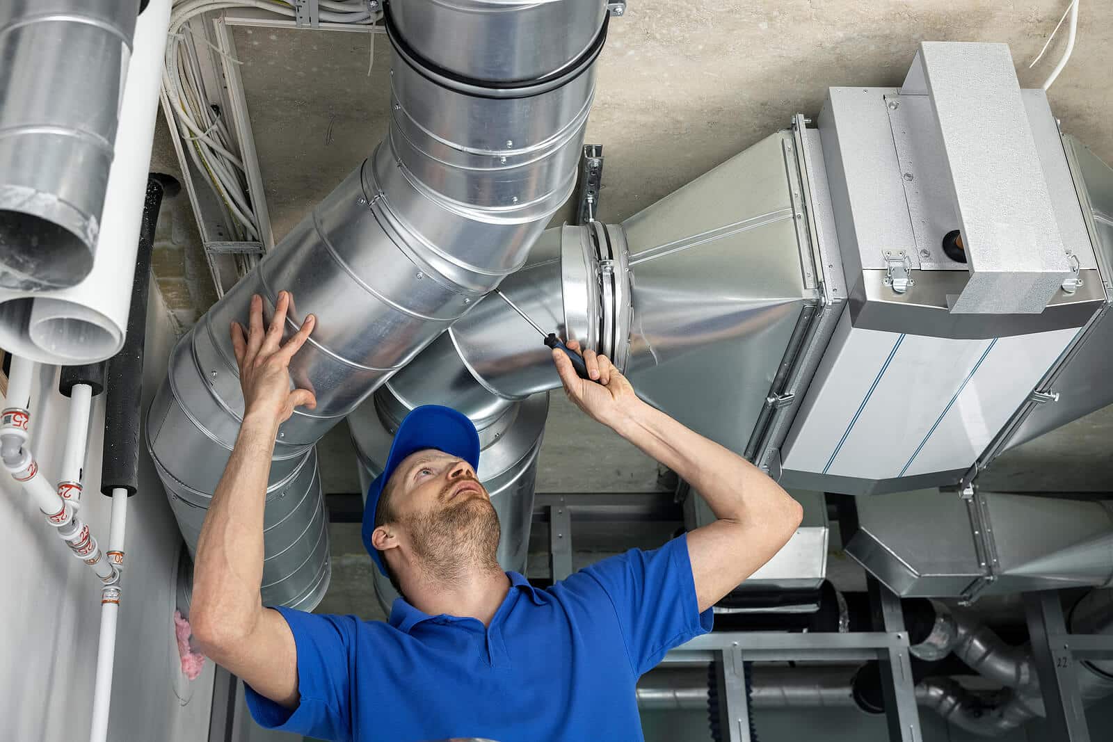 HVAC technician inspecting and repairing air ducts in Lodi