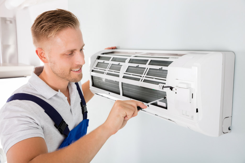 HVAC technician maintaining a ductless air conditioner in Lodi