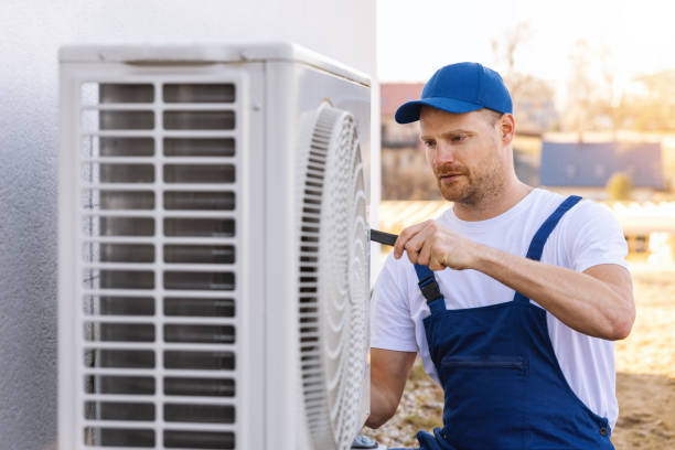HVAC technician servicing an outdoor air conditioner in Lodi