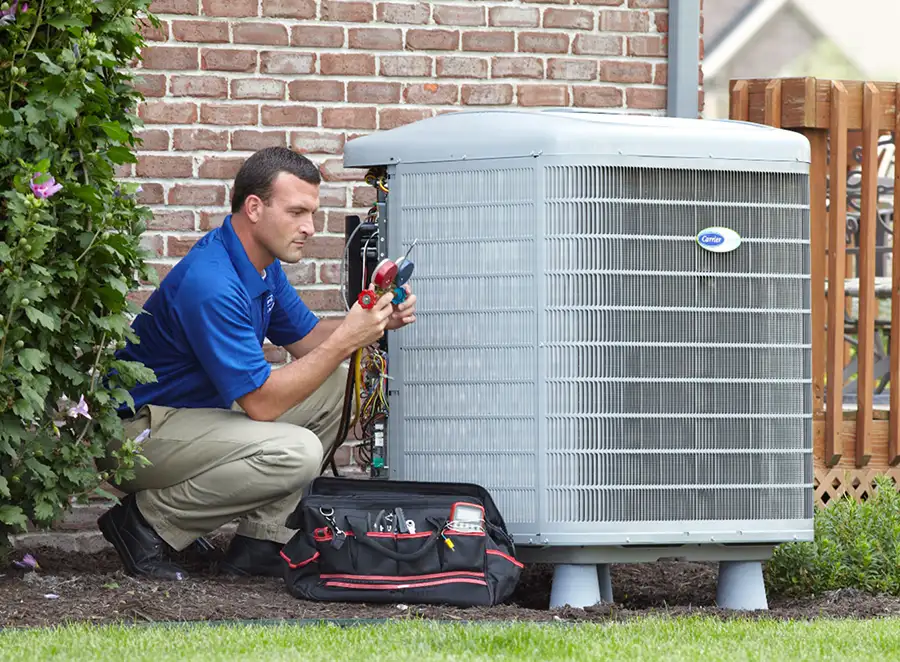 HVAC technician inspecting an outdoor AC unit in Lodi