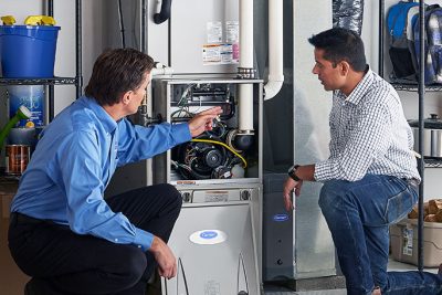 Furnace Repair or Replacement Lodi Technician evaluating a furnace for repair or replacement in Lodi