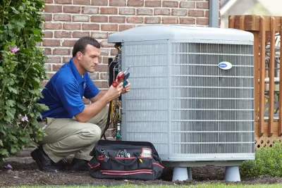 Outdoor AC Unit Inspection Lodi HVAC technician inspecting an outdoor AC unit in Lodi